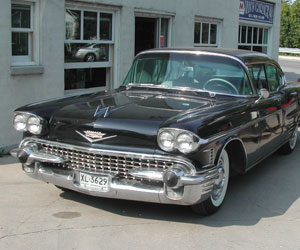 Black Cadillac in front of Van's Garage