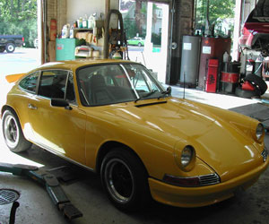 Yellow 04 Porsche 911 GT3 in the bay at Van's Garage